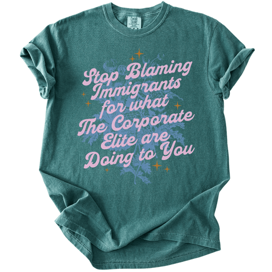 Stop Blaming Immigrants for What The Corporate Elite Are Doing to You Tee - The Rogue Petal Co. - T-Shirt